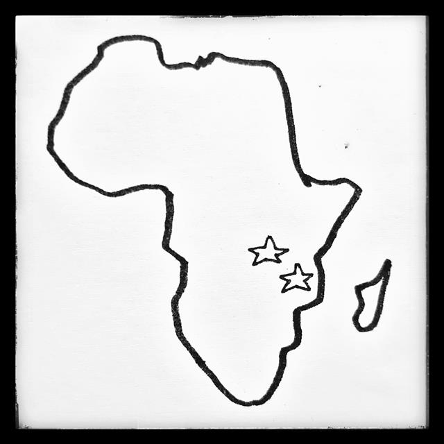 A drawn sketch of the African continent with a star for Tanzania & Rwanda.